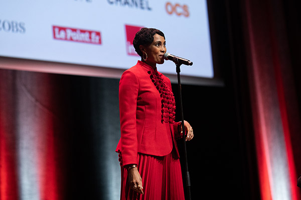 <span style='display:inline-block; background-color:#DF071E; width: 100%;padding:5px;'>Imany </span>