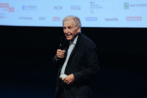 <span style='display:inline-block; background-color:#DF071E; width: 100%;padding:5px;'>Costa-Gavras</span>