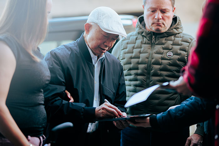 <span style='display:inline-block; background-color:#DF071E; width: 100%;padding:5px;'>John Woo</span>